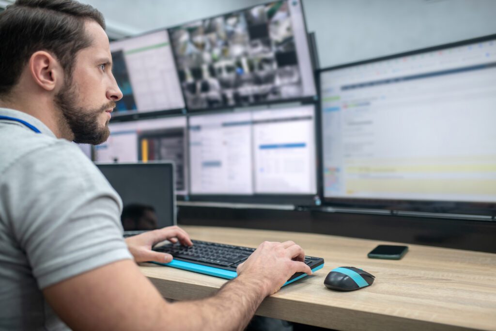 Man at advanced computer station