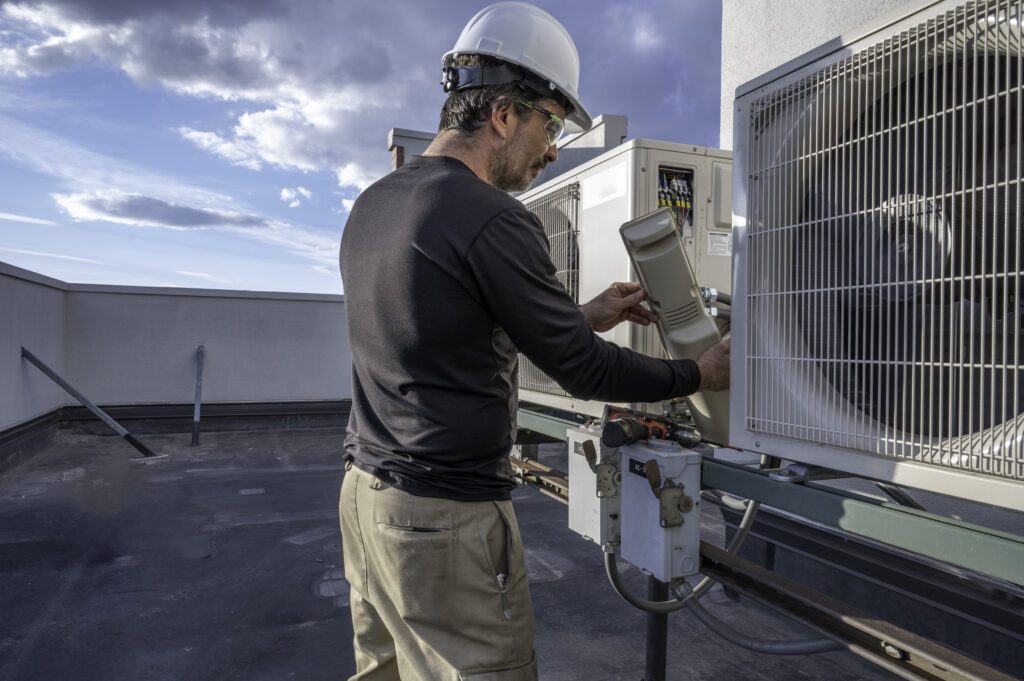 man working on HVAC equipment