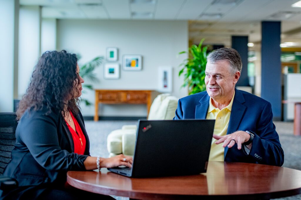 VAcorp team members working in the office